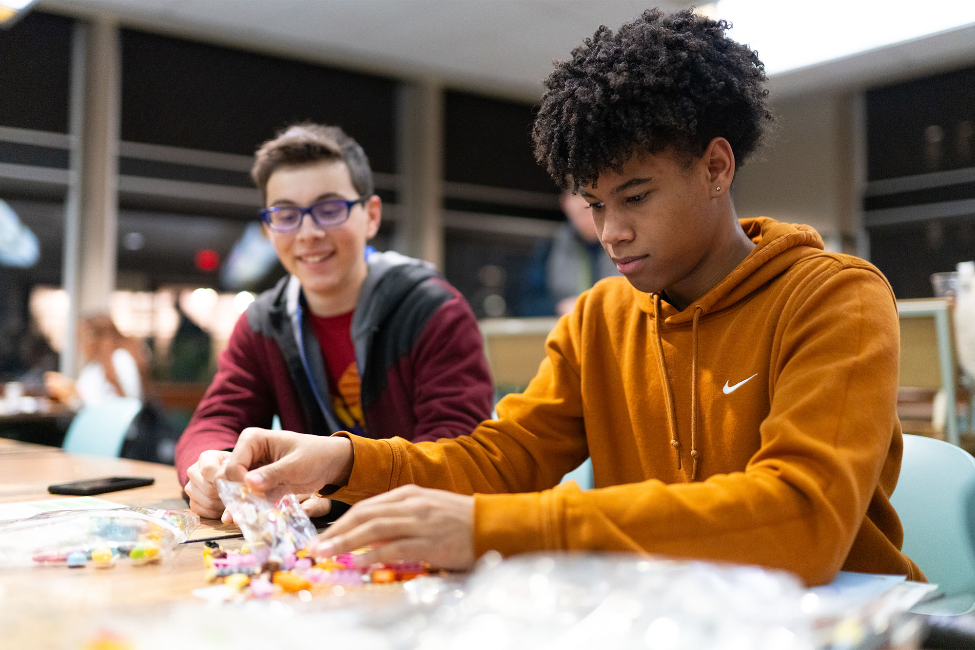 Photo: Two college students working on a lego project together