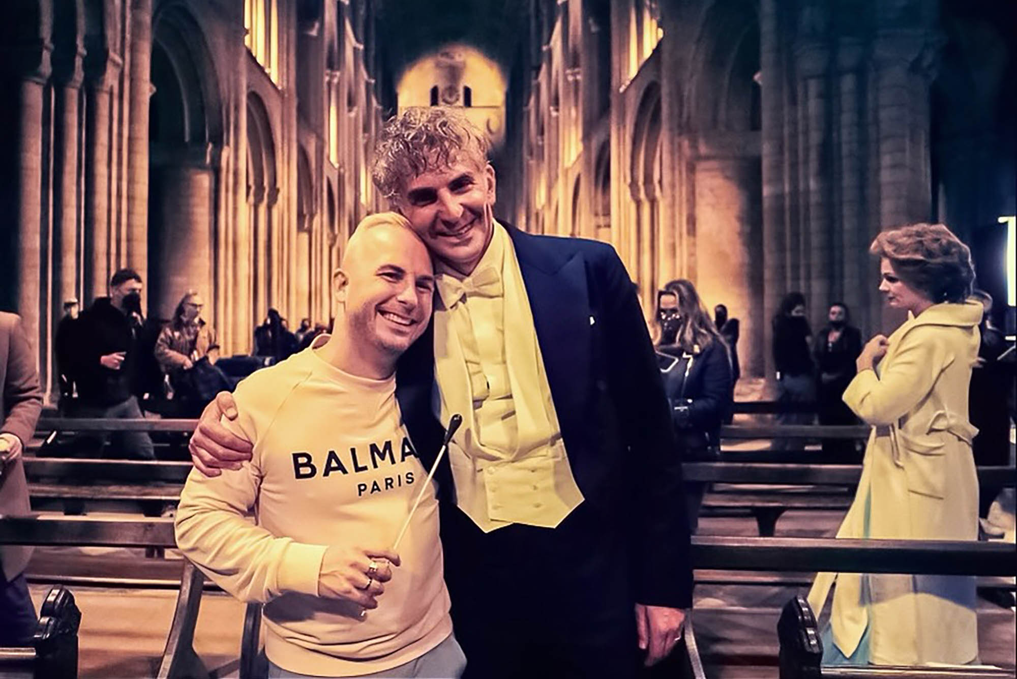 Photo: Yannick Nezet-Seguin and Bradley Cooper stand side-by-side and smile for a photo. Bradley Cooper is dressed as Leonard Berstein for Maestro.