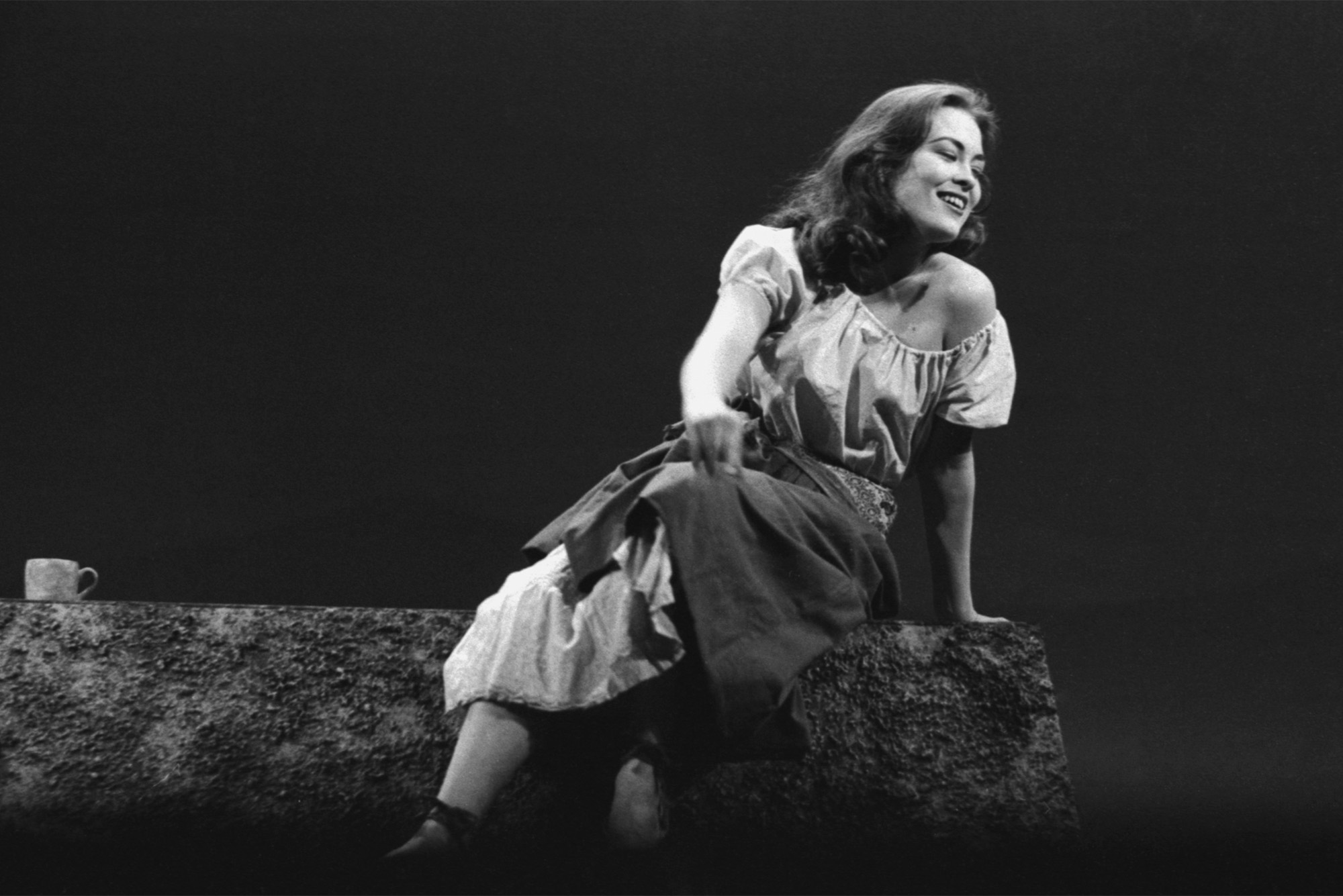 Photo: A young woman in a 1961 production of The Crucible at Boston University