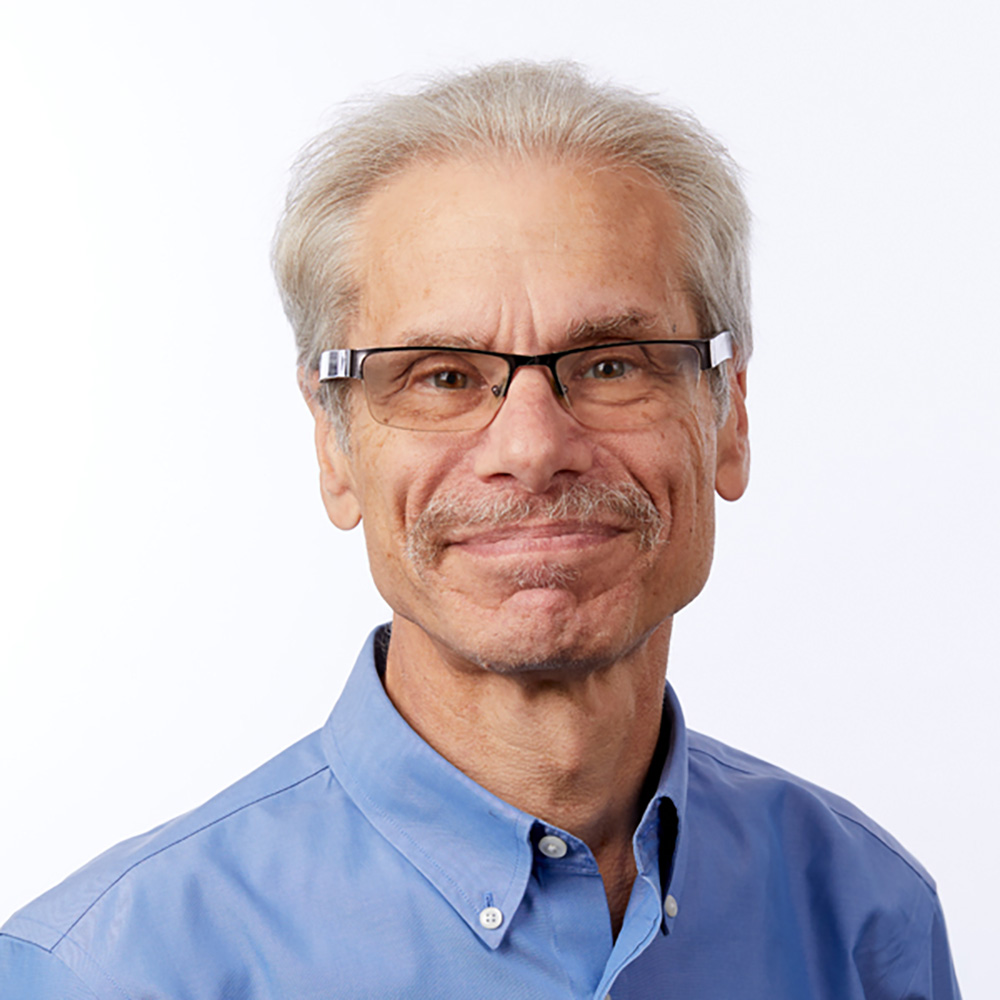 Photo: Portrait of David Felson, a man with gray hair and glasses.