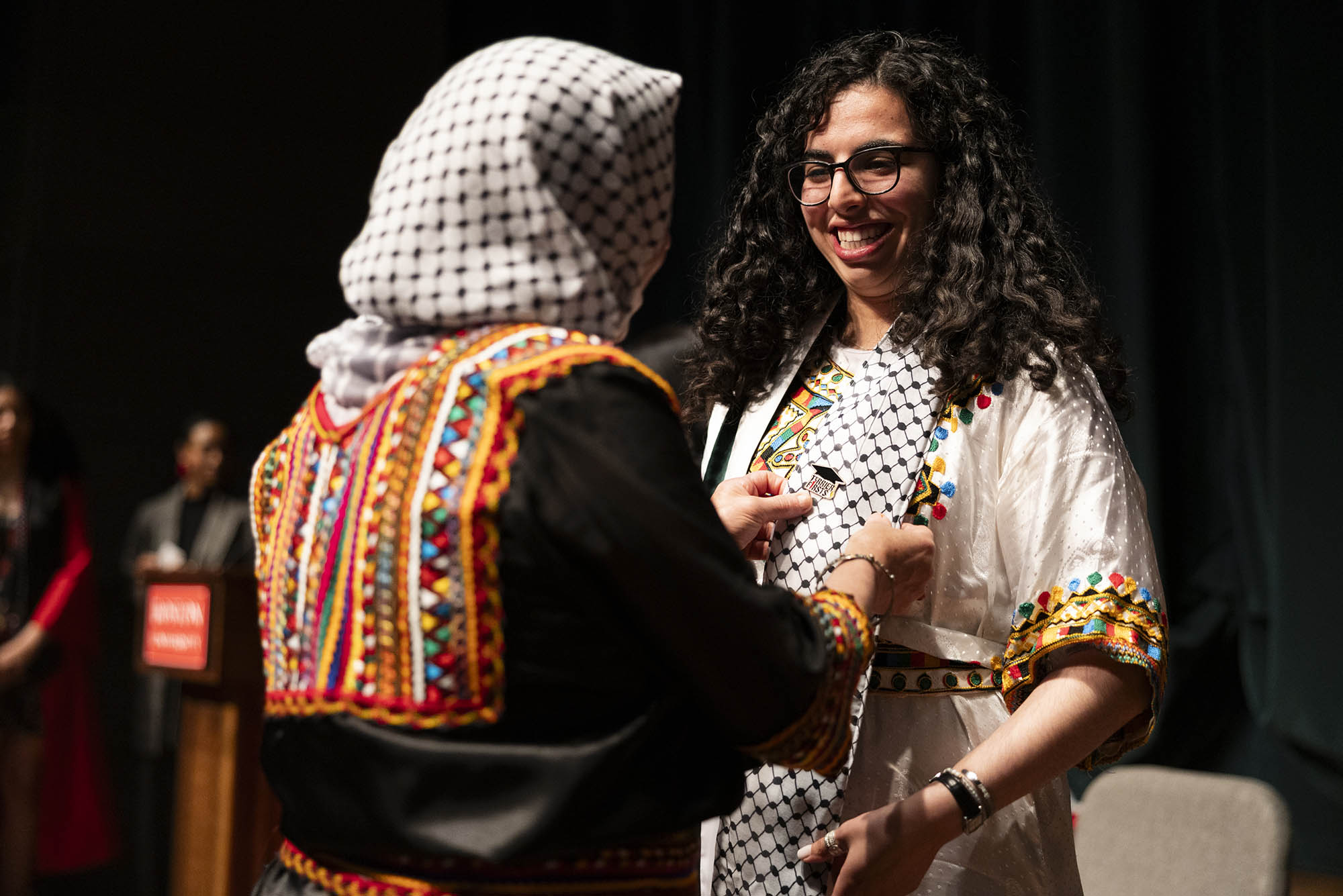 Photo: Miriam Bounar (ENG’24) (right) is pinned by her mom, Aicha Bounar with a Terrier Firsts pin as a first generation graduating college student in her family during the fourth annual Newbury Center Pinning Ceremony.