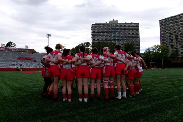 Photo: The BU women’s rugby club team huddles during a game against UConn on Nickerson Field on October 6