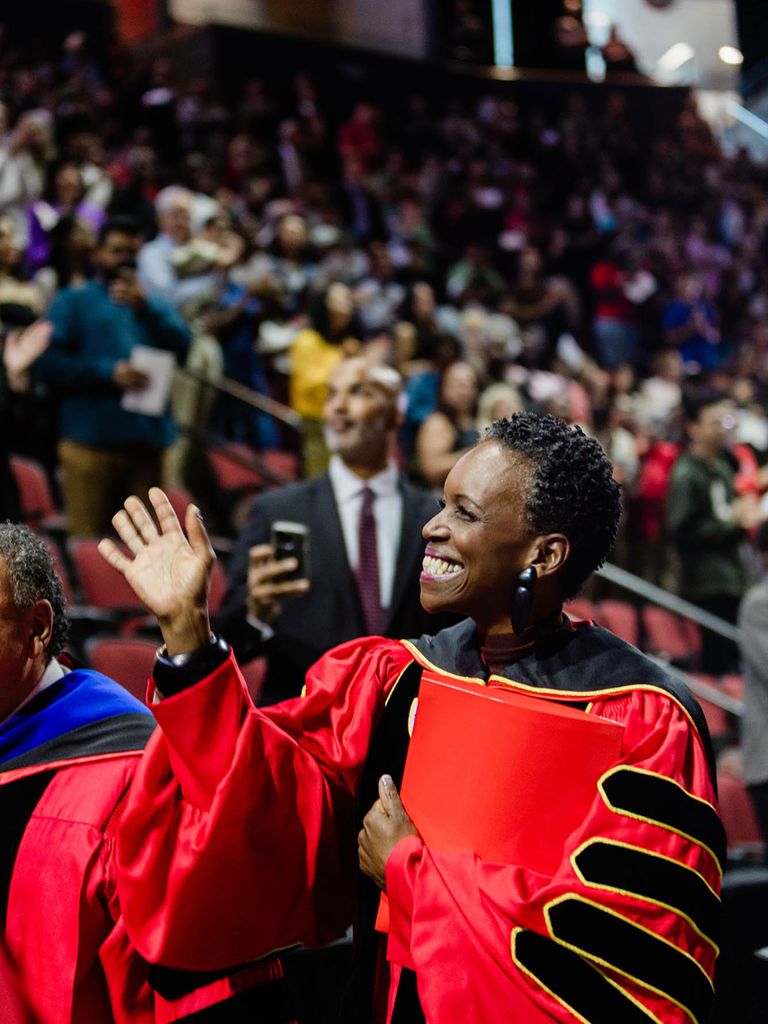 Photo: Melissa L. Gilliam waving at a crowd during her inauguration
