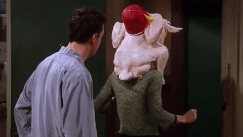Friends character with a turkey on their head from the thanksgiving episode of the show. 