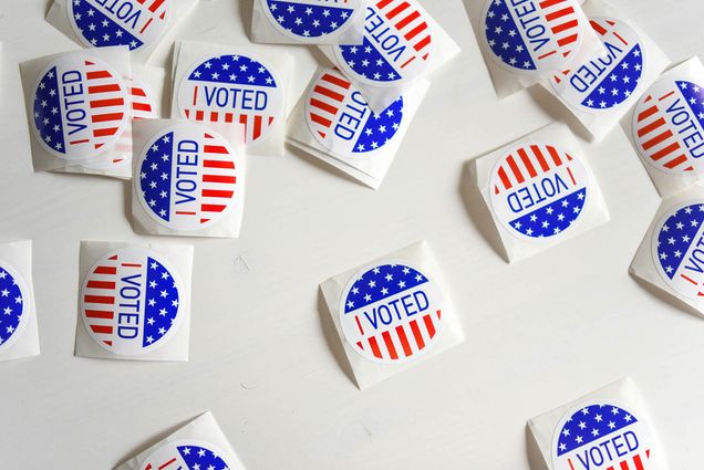 Photo: An overlay shot of various I VOTED stickers.