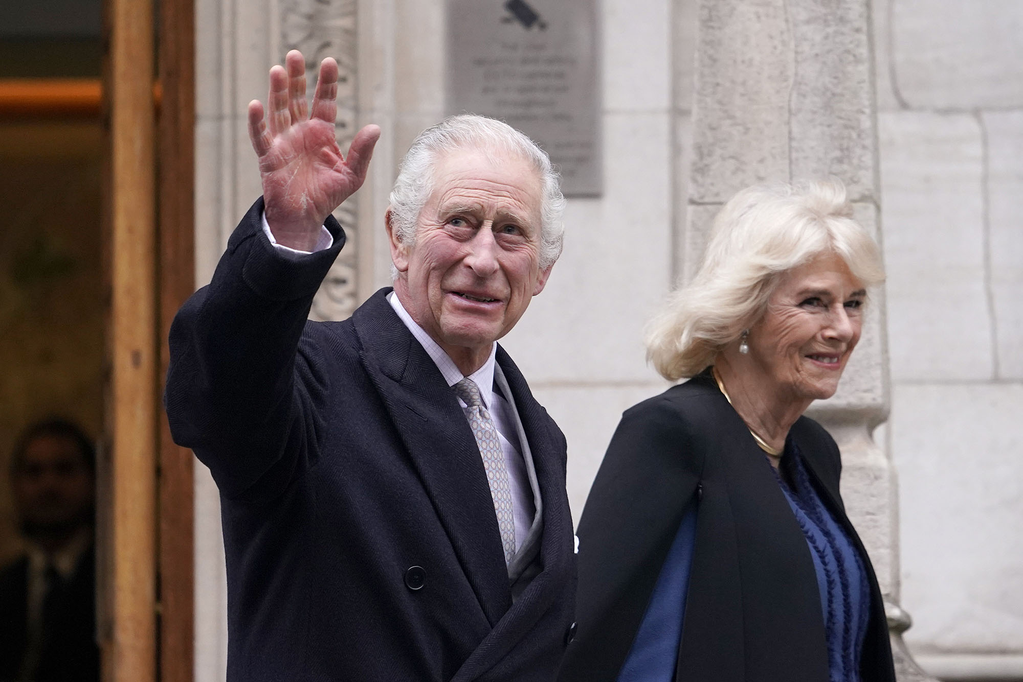 Photo: King Charles and Camilla leave The London Clinic in black coats.