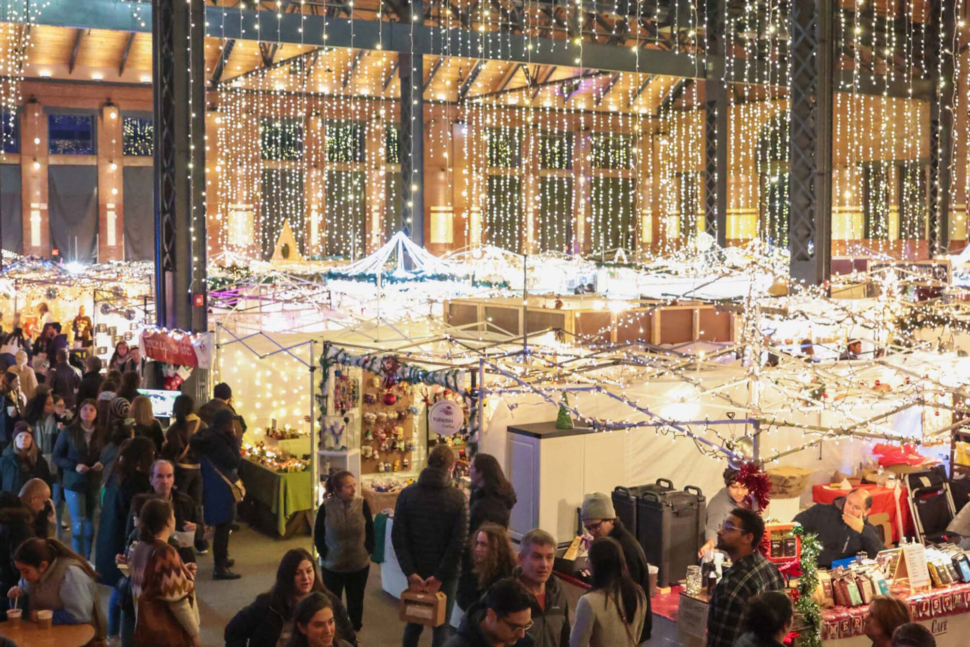 Photo: The SOWA Winter Market, an indoor holiday market with lights hanging from the ceilings
