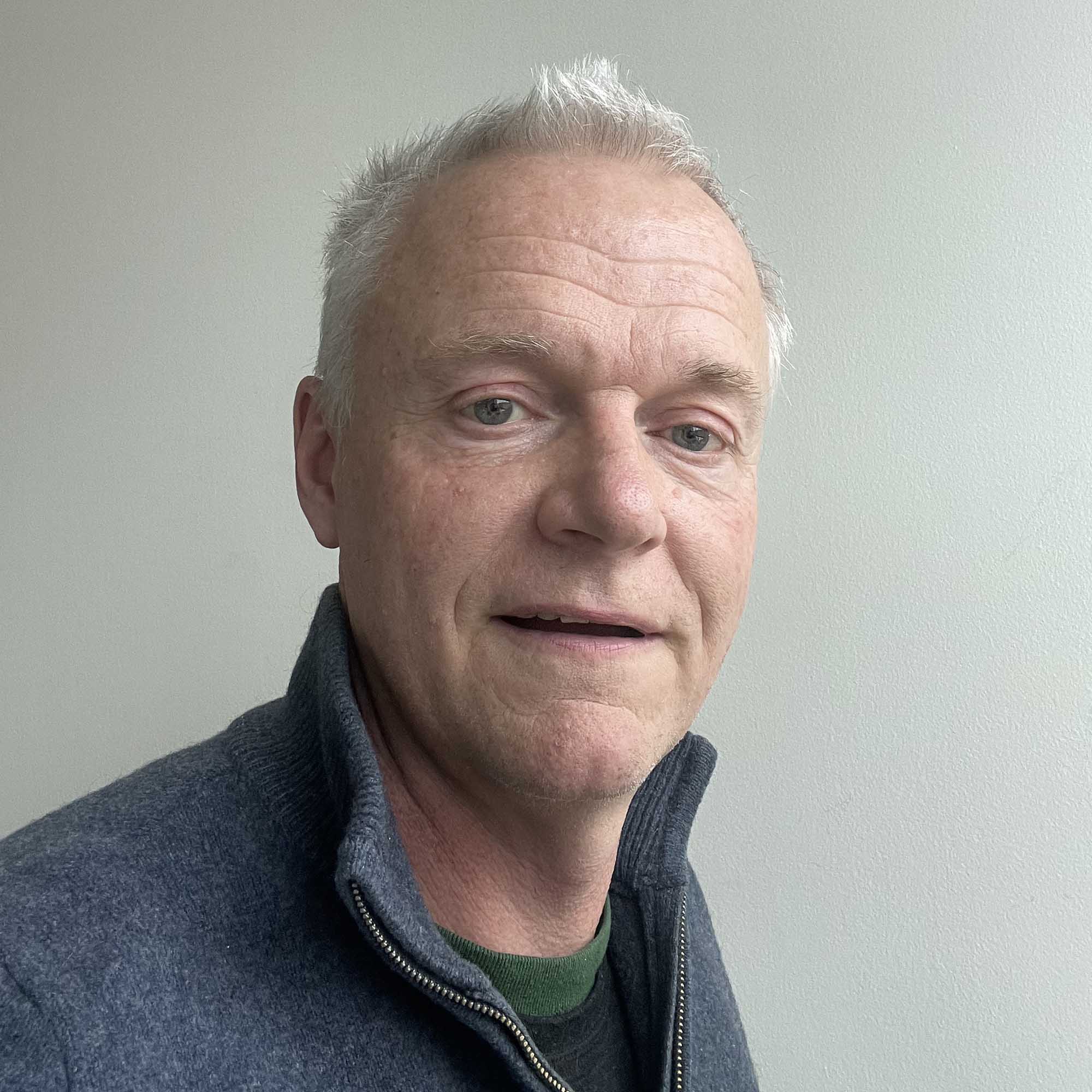 Photo: A white man taking a selfie-type photo.