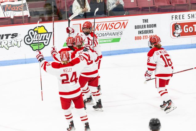 Photo: BU women's hockey players celebrate a goal at a recent game