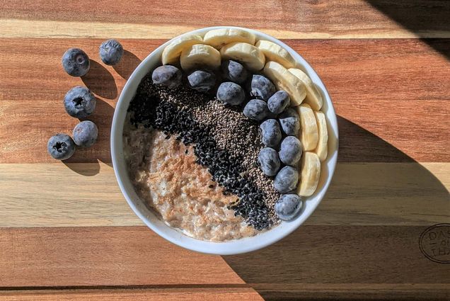Photo: A bowl of oatmeal topped with bananas and blueberries