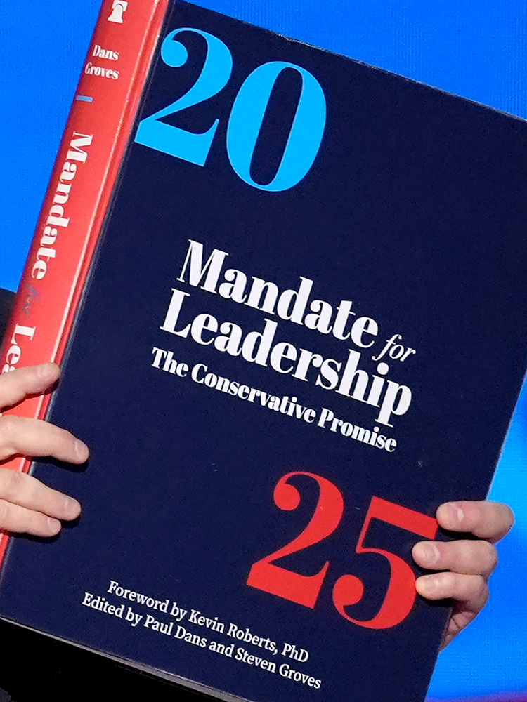 Photo: A copy of Project 2025 is held during the Democratic National Convention, Aug. 21, 2024, in Chicago. (AP Photo/J. Scott Applewhite, File)