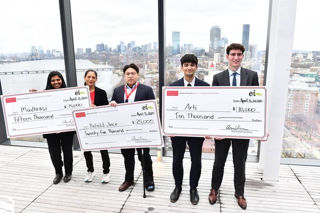 Photo: Five individuals holding three large cheques.