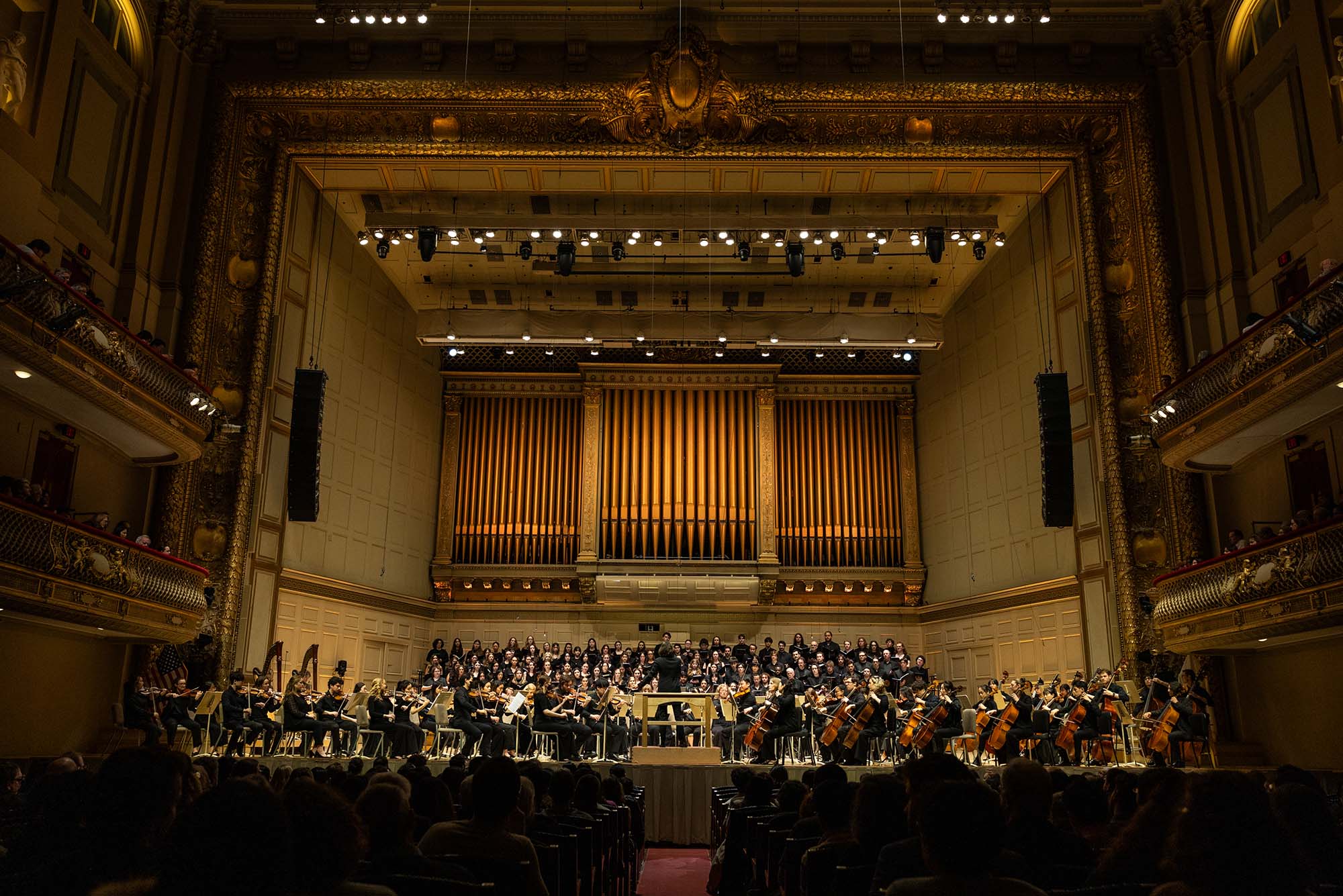 Photo: Performers from BU's College of Fine Arts on stage during a concert at Symphony Hall