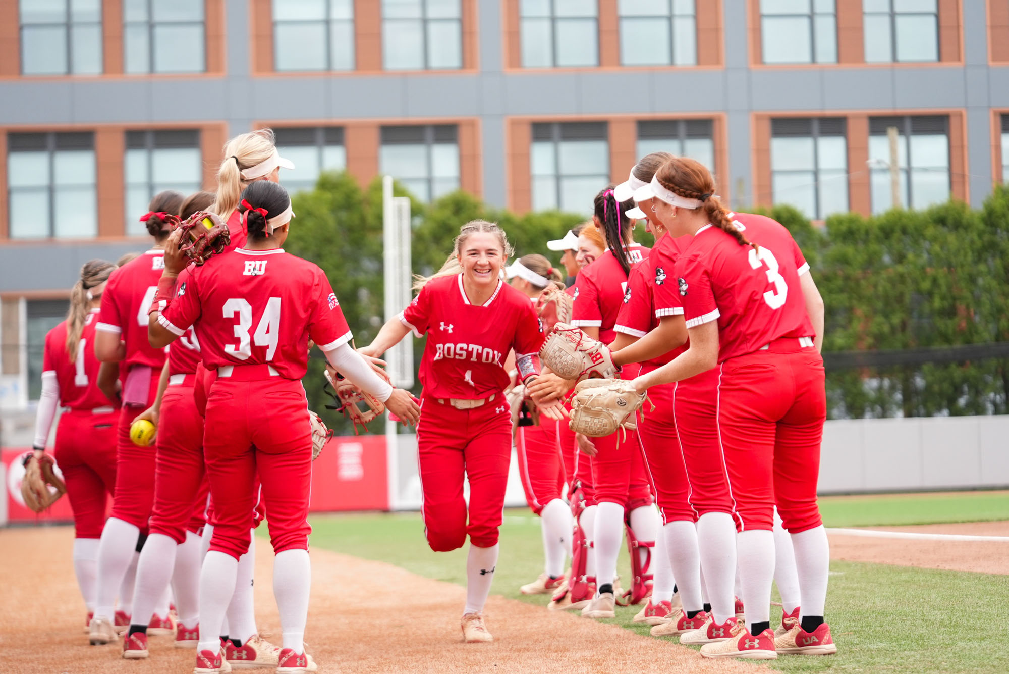 Brooke Deppiesse (Questrom’26) goes through the team tunnel during the starting lineup announcement before a game against Lafayette at BU Softball Field, May 4. Deppiesse was named Patriot League Defensive Player of the Year earlier this week. Photo by Erin Bush/BU Athletics 